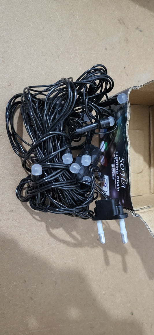 String lights with a power adapter on a cardboard box